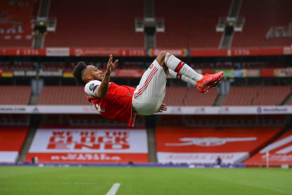 Aubameyang celebrates after scoring for Arsenal against Norwich City